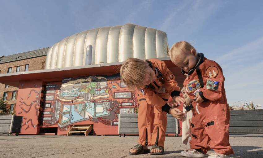 A photo of two children in personalised hand-crafted Martian spacesuits, which will be on display.