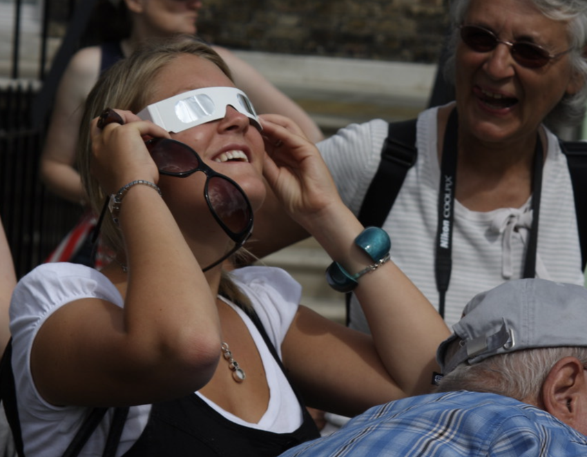 Eclipse glasses being used to view a solar eclipse.