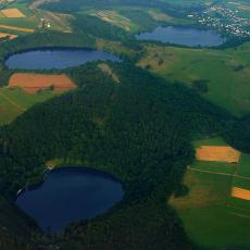 Aerial photograph of three water-filled maars in the Eifel, Germany 