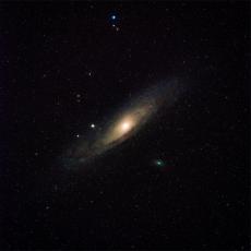 Andromeda Galaxy with a brightly illuminated centre bulge in space