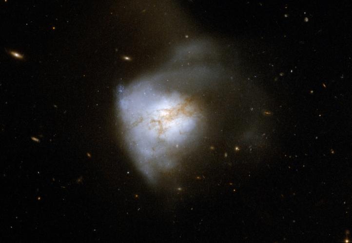 Image of Arp220 from the Hubble Space Telescope showing the large scale structure of the merging system.