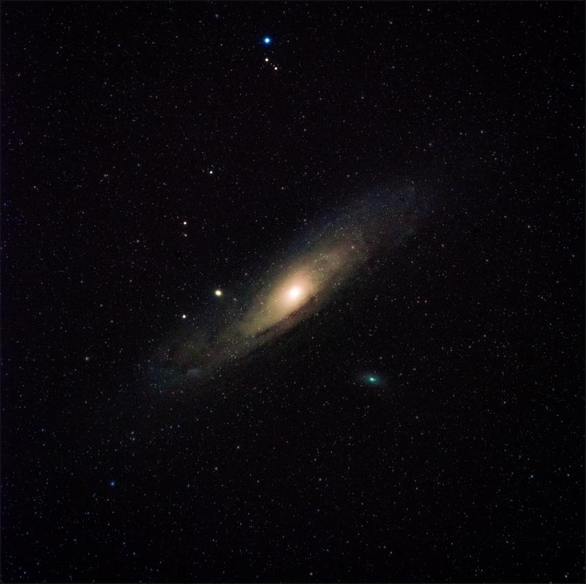Andromeda Galaxy with a brightly illuminated centre bulge in space