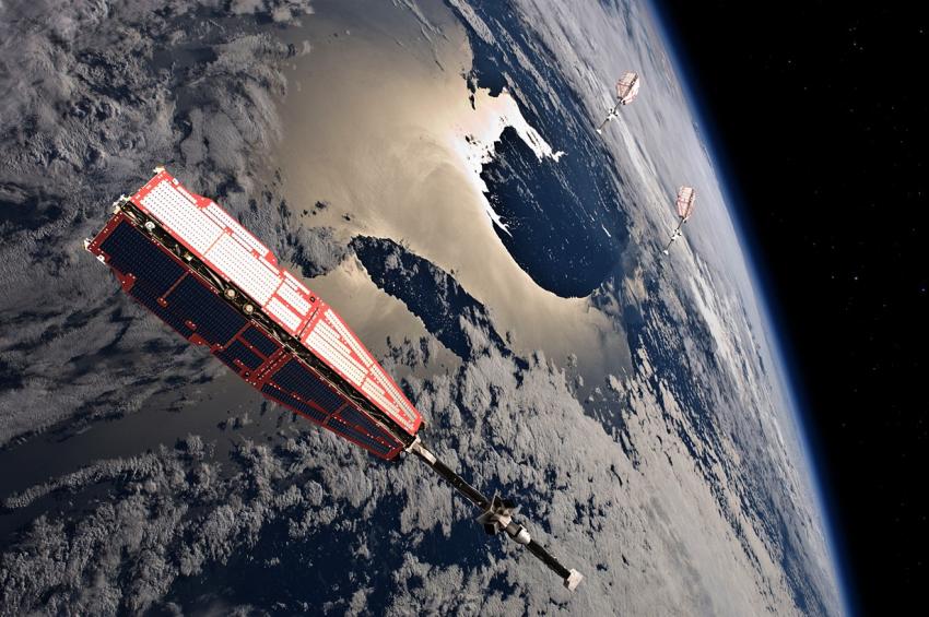 Image of ESA's Swarm spacecraft in orbit around the Earth.