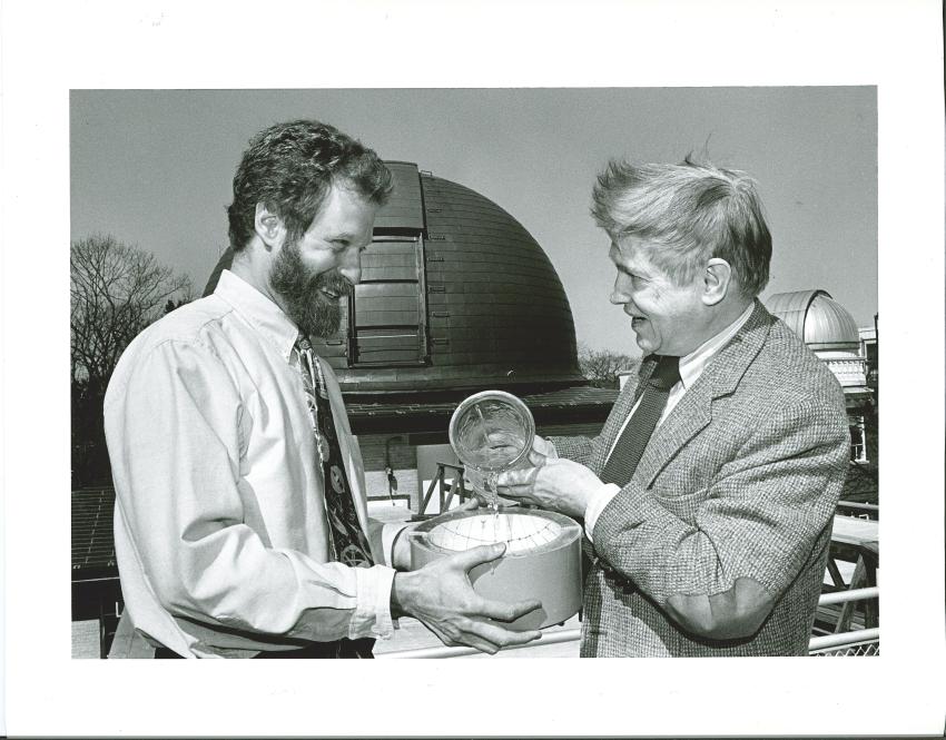  Philip Sadler & Owen Gingerich fill up a sundial with water on the roof of the Harvard University Observatory, April 25, 1995.
